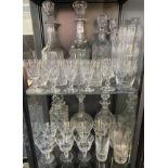 Two shelves of mixed crystal; Set of eight Stuart crystal Whisky glasses and various crystal