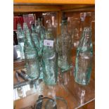 A collection of five antique Dunfermline, Kinross, Kirkcaldy and Glasgow glass bottles to include