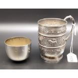 Victorian Glasgow silver drinking cup with handle; highly decorative showing raised relief African