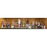 Shelf of various figurines to include figures of a musical theme
