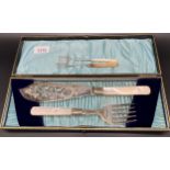 Antique boxed set of E.P Serving knife and fork with Sheffield silver collars and Mother of pearl
