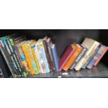 A Shelf of mixed books; Dungeons & Dragons, Middle Earth Role Playing book, Terry Pratchett and many