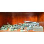Shelf of various dinky military tank and canon models etc