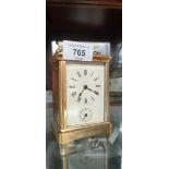 Antique brass carriage clock with bell alarm movement.