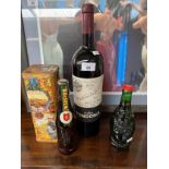Three bottlings of alcohol; Vinos Finos de Rioja 2005. Holsten Bier and Lucky Beer Buddha shaped