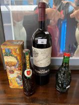 Three bottlings of alcohol; Vinos Finos de Rioja 2005. Holsten Bier and Lucky Beer Buddha shaped