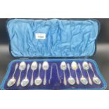 Box set of Twelve Sheffield silver tea spoons and matching sugar tongs. Produced by Atkin Brothers.