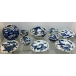 Selection of Antique Chinese blue and white dragon design cups and saucers, matching bowl, one other