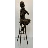 Bronze Art Deco inspired sculpture of a seated lady on a high chair. Signed D.H. Chiparus. [27cm