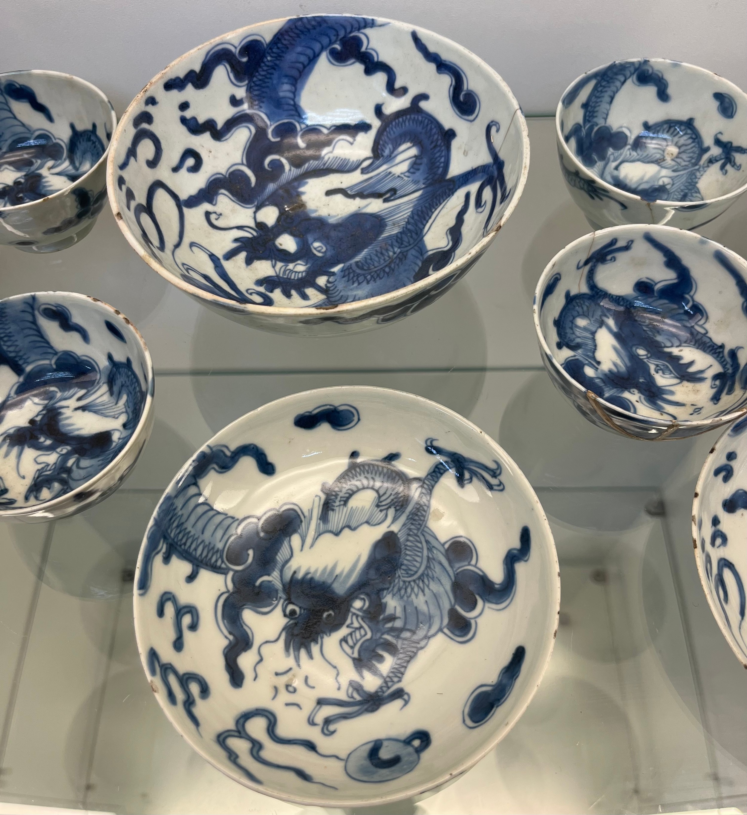 Selection of Antique Chinese blue and white dragon design cups and saucers, matching bowl, one other - Image 3 of 7