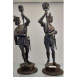 A Pair of antique Spelter bronzed soldier figural candlesticks. [38cm high] [Signs of old repairs]