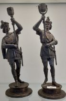 A Pair of antique Spelter bronzed soldier figural candlesticks. [38cm high] [Signs of old repairs]