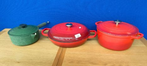 Three enamelled cooking pots/ lidded tureens. Le Creuset Green lidded pot, Ernesto red lidded two