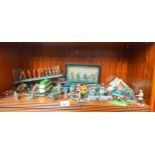 Shelf of collectable figures and models; Britains soldiers, Lead soldiers, Canons and various