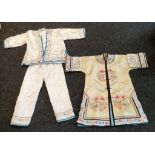 Two Chinese items of clothing; Chinese Silk and embroidered tang shirt and a two piece silk and