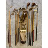 Antique golf bag and hickory shaft golf clubs; R. Simpson Carnoustie, Niblick, T. Mounce, Two wooden