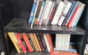 Two shelves of mixed books.