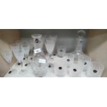 Shelf of Stuart Crystal decanters, wine glasses and whisky glasses