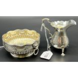 Two items of Silver; Highly decorative London silver sugar dish designed with raised relief lion