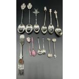 A Collection of mixed silver spoons and condiment spoons; Three silver hunting presentation