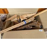 Box of bamboo made flutes and instruments