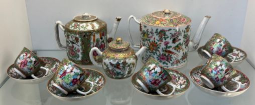 Chinese Famille Rose design hand painted Tea pots, cups and saucers. Three tea pots, five cups and