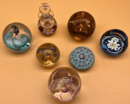 A Lot of seven various paperweights; Caithness paperweights- 'Freedom' ltd 166/650, 'Sparkle' R6407,