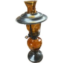 Vintage amber glass and metal made paraffin lamp.