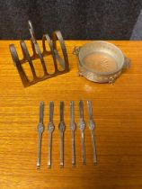 A Set of six Sheffield silver lobster forks, Sheffield silver four slice toast rack and Birmingham
