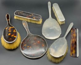 Four Birmingham silver art deco design hand brushes and hand mirror. Together with Three