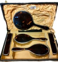 Cased Birmingham silver and tortoise shell hand brush set and hand mirror; Four hand brushes and