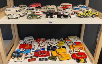 A large collection of playworn police and emergency services vehicles mostly Dinky and Corgi