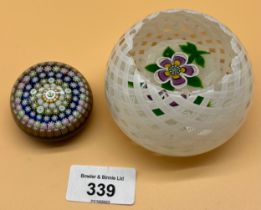 Two Scottish glass paperweights; John Deacon Ribbon Overlay and pink flower design paperweight and