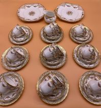 A Twelve piece setting 'New Chelsea' floral and gilt trim tea set. Comes with two cake plates and