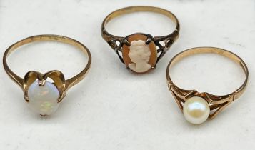 Three various 9ct yellow gold rings; Opal stones ring, Pearl ring and cameo ring. [Total weight- 4.