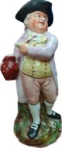 Early 19th century Staffordshire figural jug; Man holding stein of beet and pipe in the other