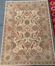 Wool pile rug depicting an ornate floral design [87x133cm]