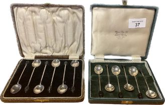 Two boxed sets of six Birmingham and Sheffield silver coffee bean spoons.