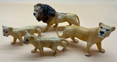 Four Beswick animals; Lion, Lioness and two cubs.