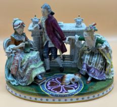 Antique large Porcelain Group figurine. Two seated women, Gentleman and a cat. Possibly German made.
