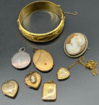 A Selection of 9ct front and back lockets, silver locket and 9ct metal core bangle. Together with