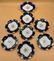 19th century Victorian English dinner service; Seven cobalt blue and white plates with floral design