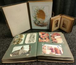 A Victorian post card album with postage cards along with 2 victorian portrait albums one empty