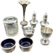 Various silver items; a pair of Birmingham silver pepper pots, London silver egg cup, Three