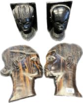 Two African hand carved bust bookends- stamped to base, together with a pair of African carved