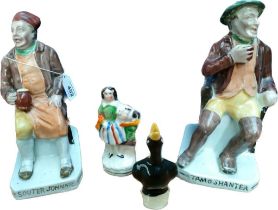 A Pair of antique Staffordshire style seated figurines and one smaller figure and bird whistle;