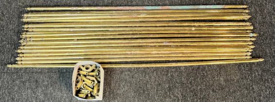 Collection of brass stair rods and brackets.