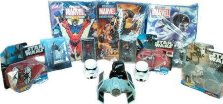 A collection of boxed star wars vehicles and marvel DC comics with figures