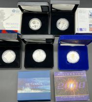 A Lot of five Boxed Sterling silver Mint coins; Millennium five pound coin with certificate, The