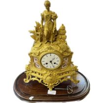 19th century gilt Ormolu figural mantel clock with a wooden base. James & Walter